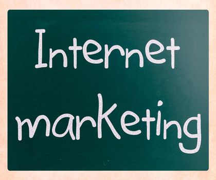"Internet marketing" handwritten with white chalk on a blackboard