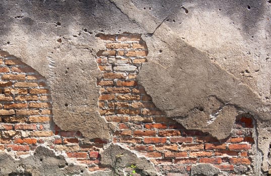 Decayed, cracked concrete vintage brick wall background.