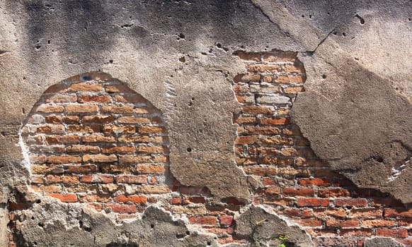 Decayed, cracked concrete vintage brick wall background.