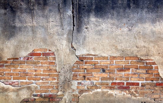 Decayed, cracked concrete vintage brick wall background.