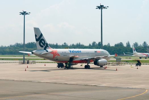 SINGAPORE - SEP 11: Jetstar airways plane stands in Changi airport on SEP 11, 2012  in Singapore. Jetstar Airways is an Australian low-cost airline headquartered in Melbourne.