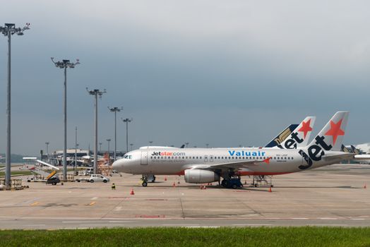 SINGAPORE - SEP 11: Jetstar airways planes stand in Changi airport on SEP 11, 2012  in Singapore. Jetstar Airways is an Australian low-cost airline headquartered in Melbourne.