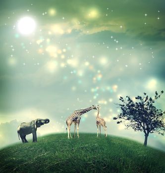 Giraffes and an elephant on a hilltop under the moon