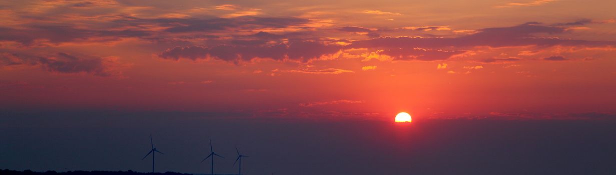 The photo sunset  and windmill