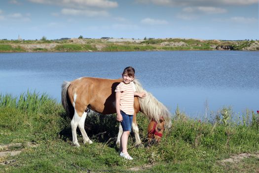 little girl and pony horse 