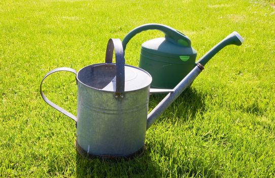 Watering cans in a yard