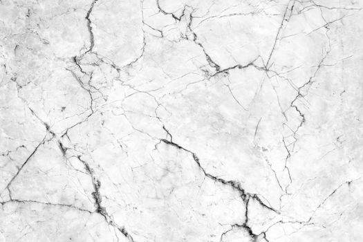 Cracks in the marble pattern tile wall.