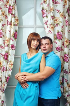 Man and woman embracing in a studio shot