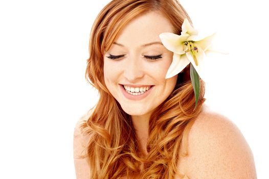 Charming young woman with white lily flower