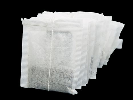 tea bags isolated on black background