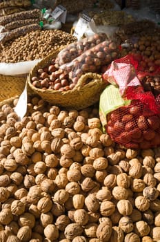 Heaps of nuts on a traditional street market stall