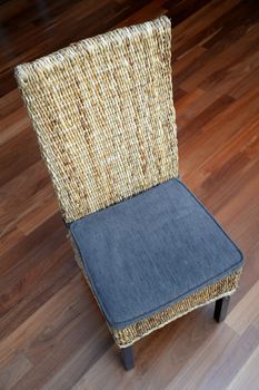 A dinning chair isolated on a wooden floor