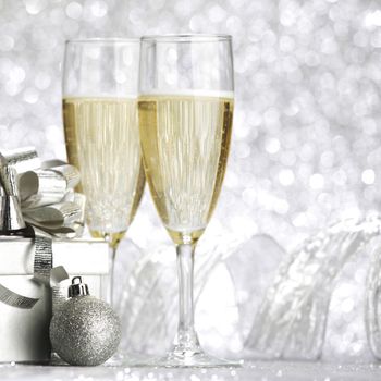 Beautiful silver christmas card with champagne and gift