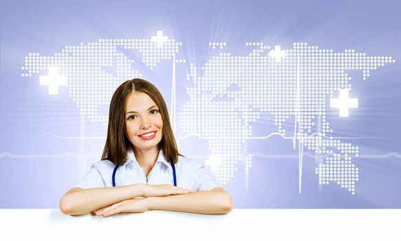 Image of young female doctor with blank banner. Place for text