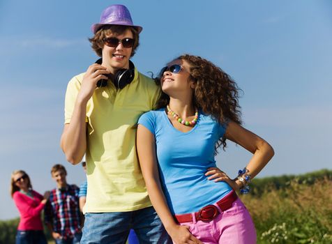 Young man and young woman outdoors. Summer vacation