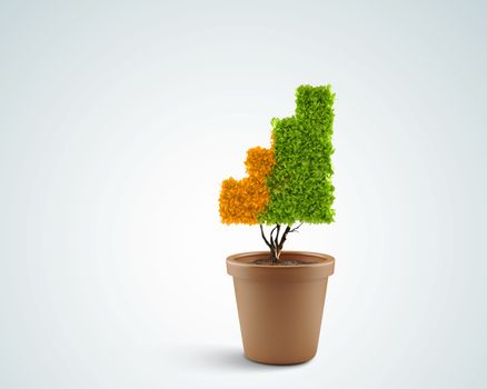 Plant in pot shaped like graph. Wealth concept