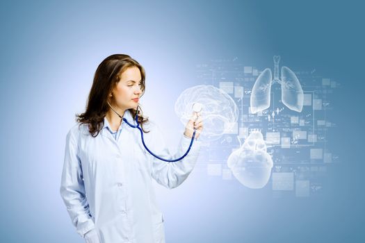 Image of young woman doctor touching icon of media screen