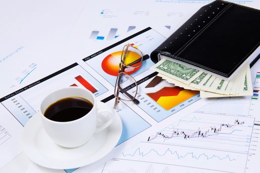 Close up image of office workplace with cup of coffee and documents