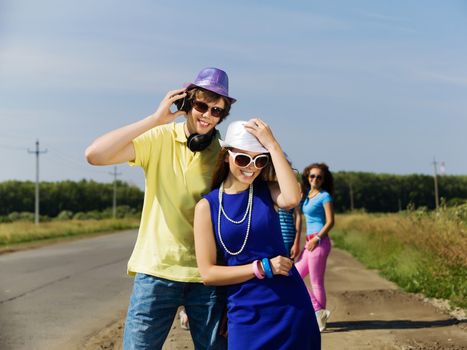 Young man and young woman outdoors. Summer vacation