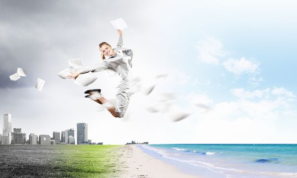 Image of businesswoman jumping joyfully. Summer vacation
