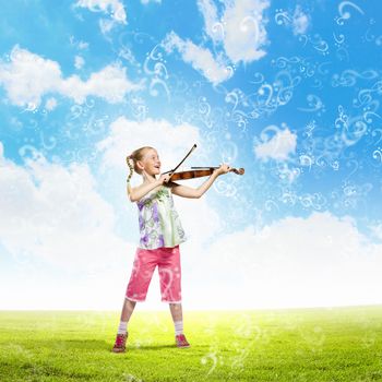 Image of cute girl playing violin outdoors