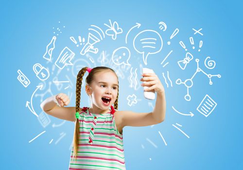 Image of little angry girl shouting in mobile phone