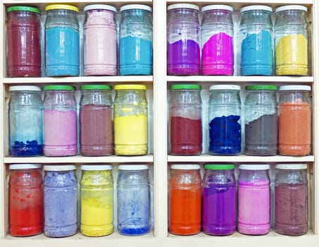 assortment of glass jars on shelves in herbalist shop in marrakesh, morocco, containing herbs and spices for medicinal and culinary purposes