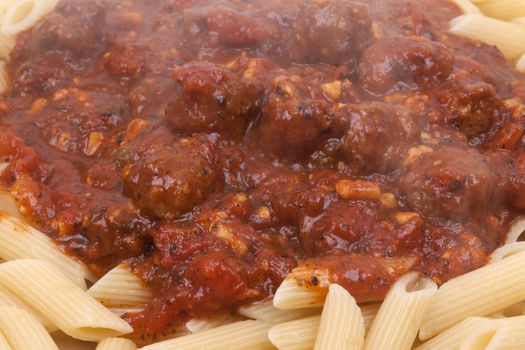 meatballs in tomato sauce with penne pasta.