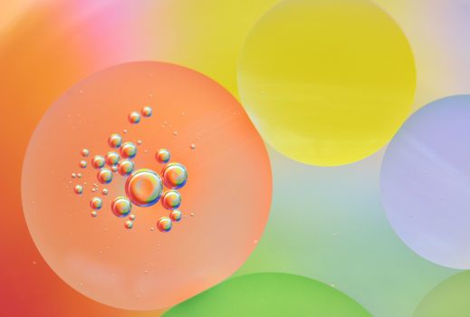 Close up of colorful bubbles on colored background