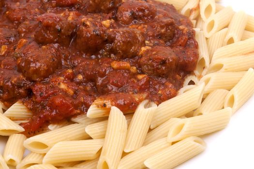 meatballs in tomato sauce with penne pasta.