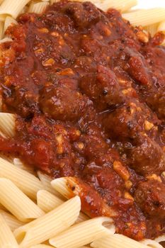 meatballs in tomato sauce with penne pasta.