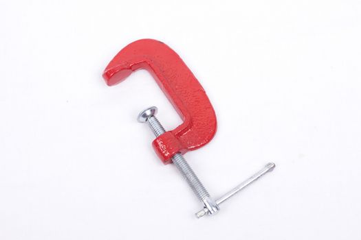 Red clamp isolated on a white background