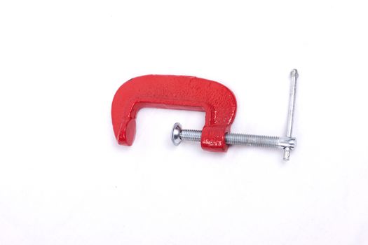 Red clamp isolated on a white background