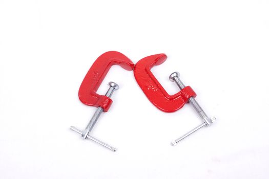 Red clamps isolated on a white background