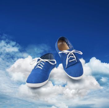 Blue shoes dancing on clouds, soft walking concept