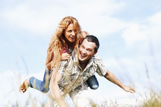 man and woman hug in the sky