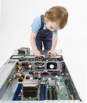 young child working on network server. studio shot in grey background
