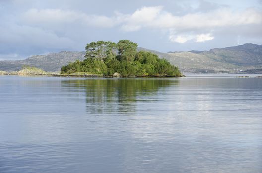 Water and lake with islands and clouds, ocean around Bergen in Norway