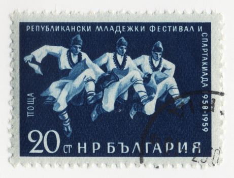 BULGARIA - CIRCA 1958: stamp printed in Bulgaria, shows male dancers in traditional costumes, circa 1958