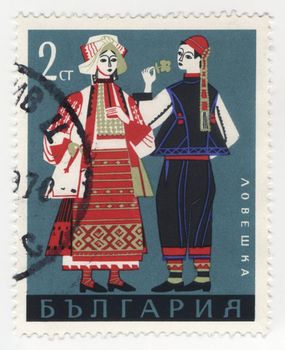 BULGARIA - CIRCA 1968: stamp printed in Bulgaria, shows man and woman in Bulgarian traditional costumes from Lovech region, series, circa 1968