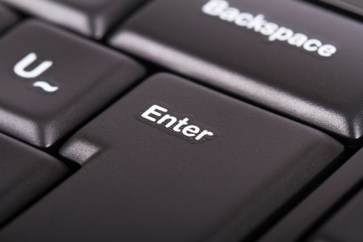 Enter key on black computer keyboard.