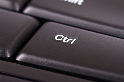 Close up view of ctrl button on black keyboard.