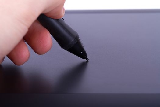 Illustrator drawing with digital pen on graphic tablet, isolated on white background.