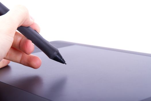 Illustrator or artist hand holding digital pen on graphic tablet, isolated on white background.