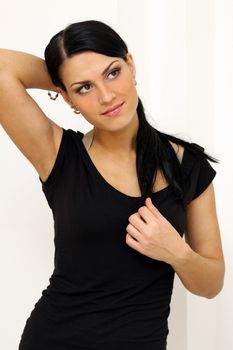 Beautiful young woman in gray background