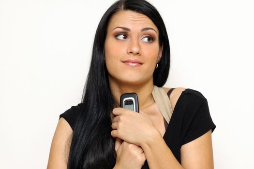 Young beautiful woman talking on cell phone
