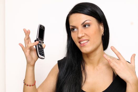 Young beautiful woman talking on cell phone