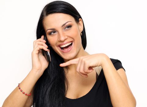 Young beautiful woman talking on cell phone