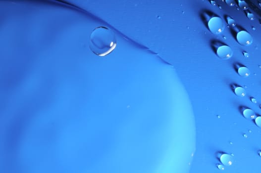 Some Water Drops on a Blue Textured Background