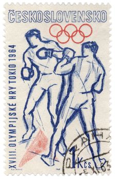 CZECHOSLOVAKIA - CIRCA 1963: A stamp printed in Czechoslovakia, shows boxers fight, devoted to Olympics in Tokyo, series, circa 1963